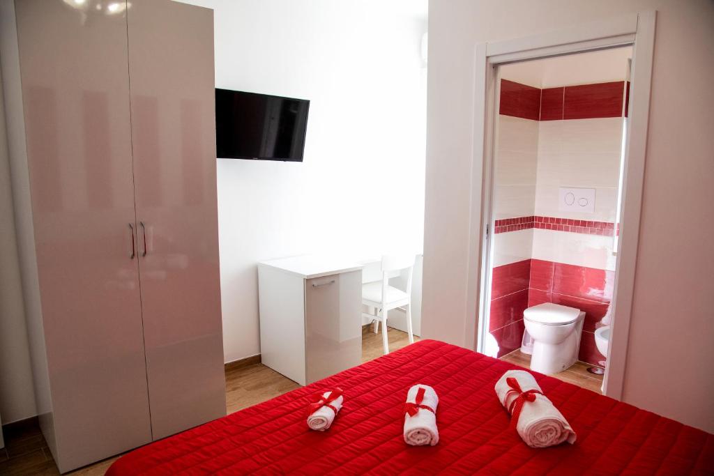 Posteľ alebo postele v izbe v ubytovaní b&b binario nove e tre quarti