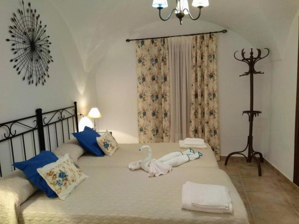 Säng eller sängar i ett rum på Apartamentos Rurales Tía María