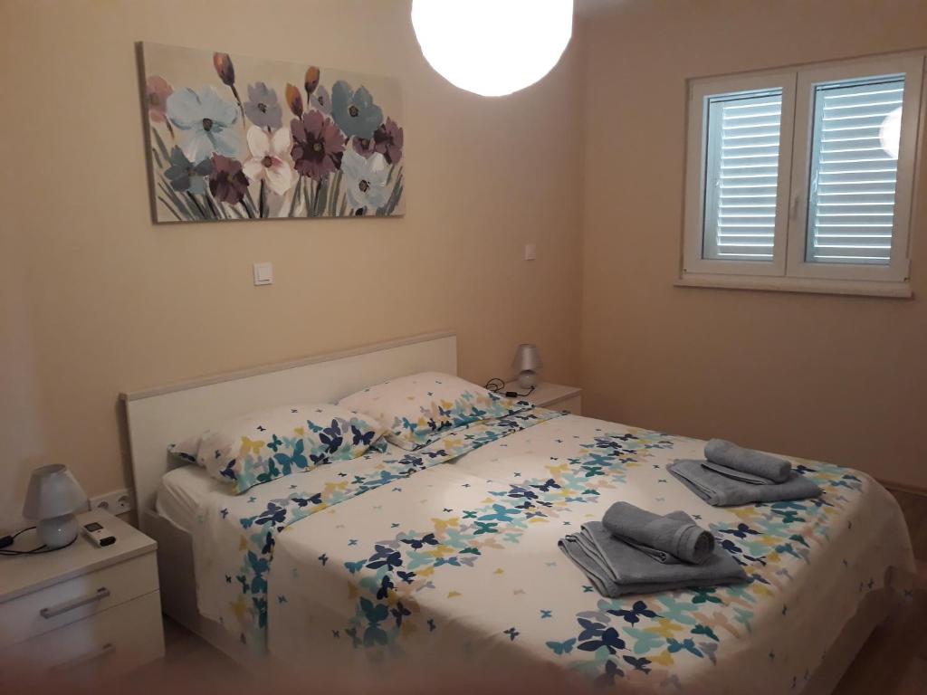 Posteľ alebo postele v izbe v ubytovaní Apartments Juliet