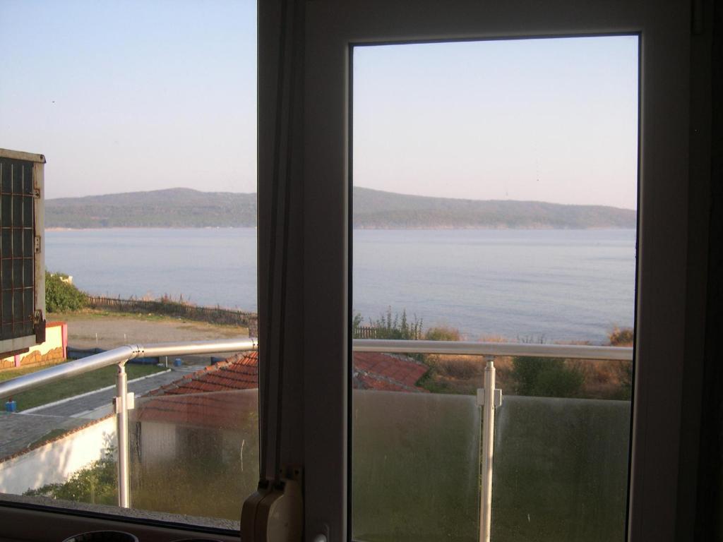 a window with a view of a body of water at Ulitsa Treti Mart North in Primorsko