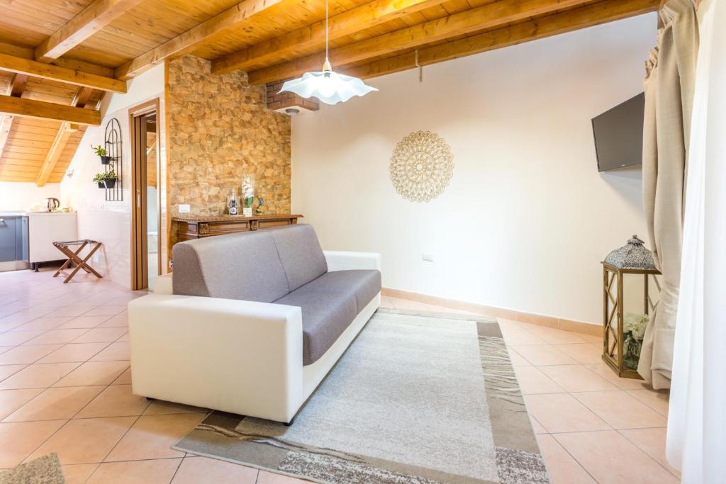 Televízia a/alebo spoločenská miestnosť v ubytovaní Guest House Casa del Folletto