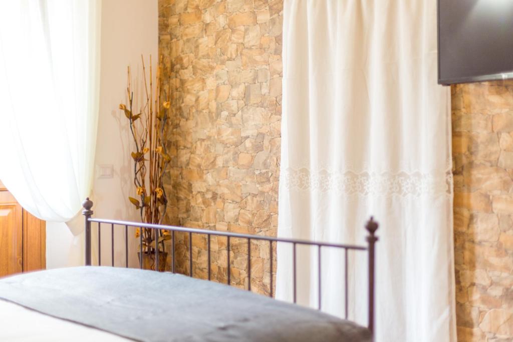 Posteľ alebo postele v izbe v ubytovaní Guest House Casa del Folletto