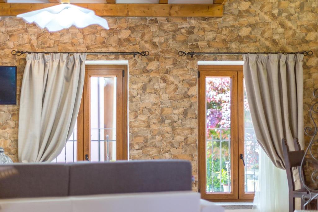 Televízia a/alebo spoločenská miestnosť v ubytovaní Guest House Casa del Folletto
