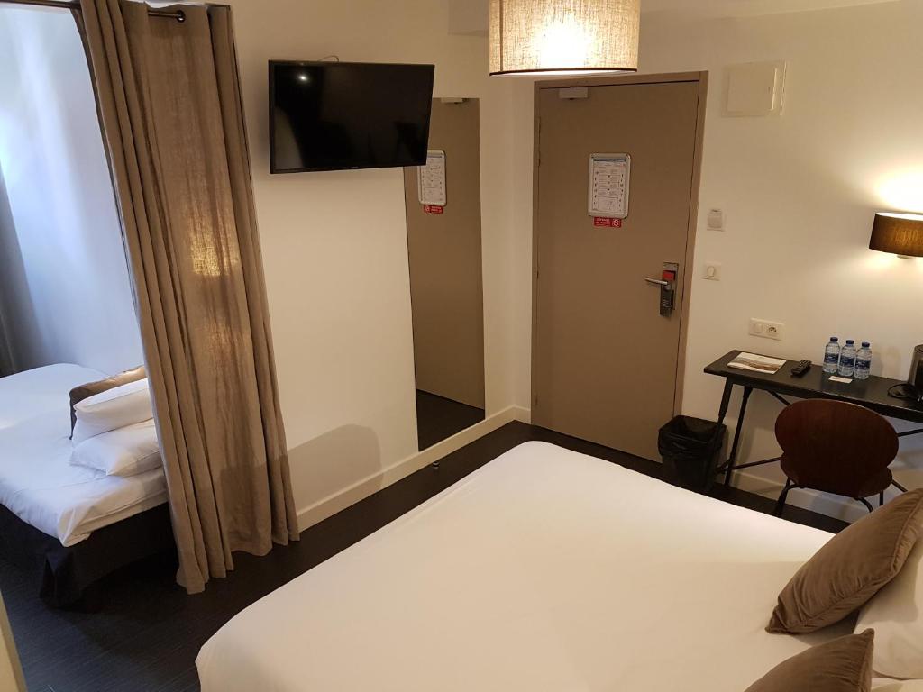 Postel nebo postele na pokoji v ubytování Hôtel Au Bon Coin
