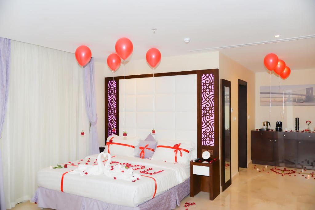 Postel nebo postele na pokoji v ubytování Aster Hotel