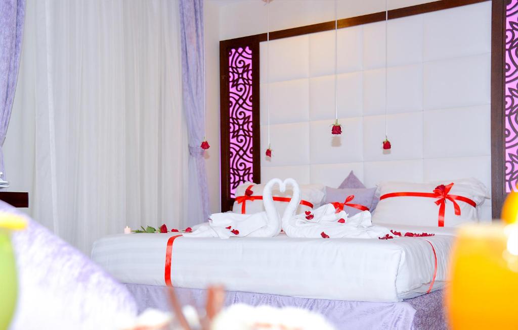 Postel nebo postele na pokoji v ubytování Aster Hotel