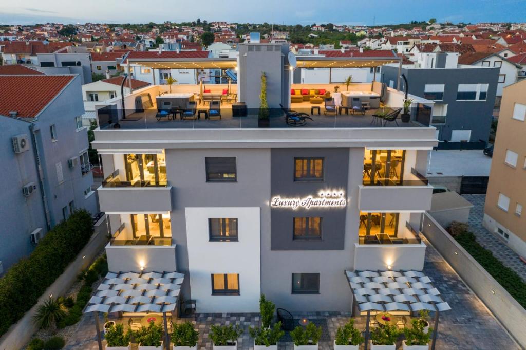 an aerial view of a building with a restaurant at Luxury Majpruz Suites in Zadar