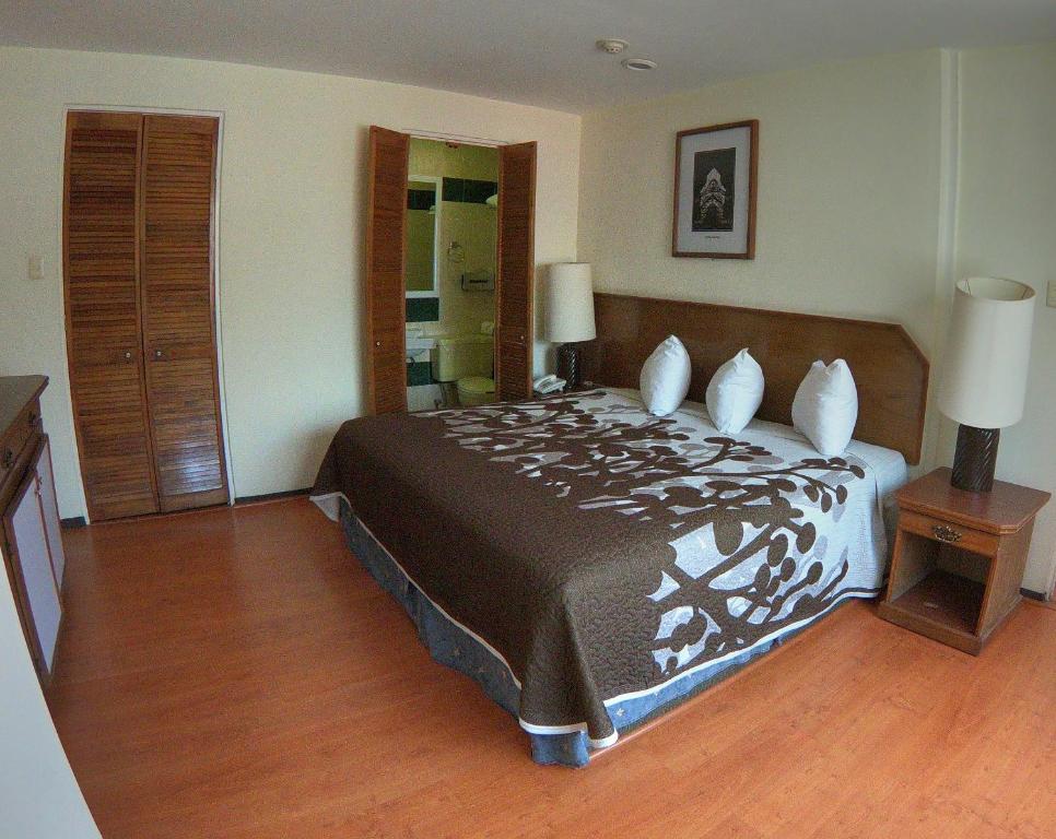 Postel nebo postele na pokoji v ubytování Hotel Posada Vista Bella