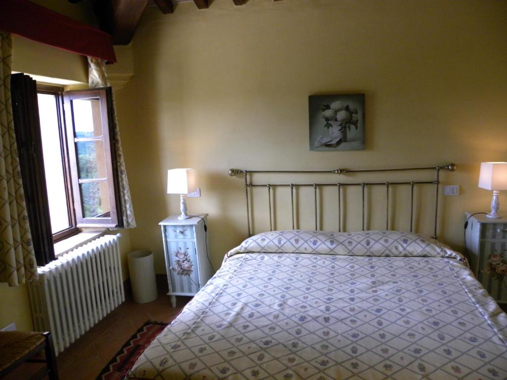 Łóżko lub łóżka w pokoju w obiekcie Torraccia di Chiusi Agriturismo Relais
