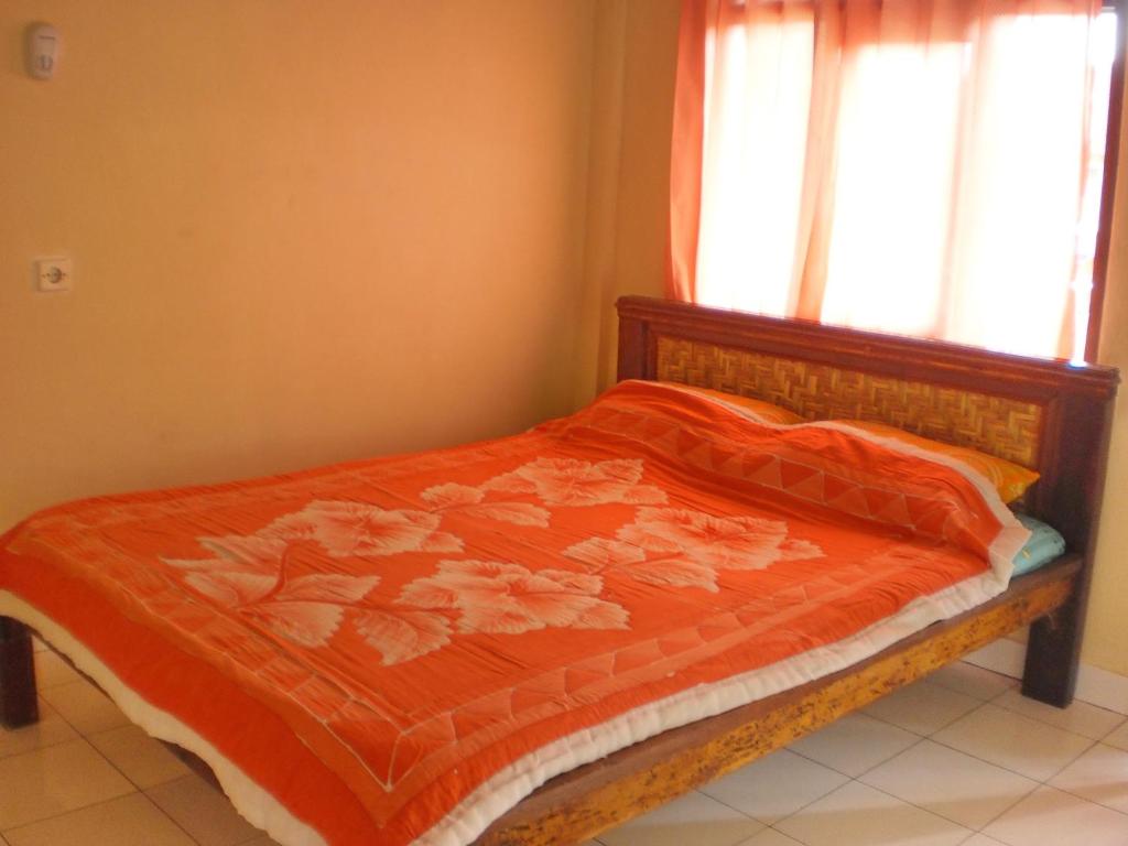 Postel nebo postele na pokoji v ubytování Arjuna Homestay Ubud