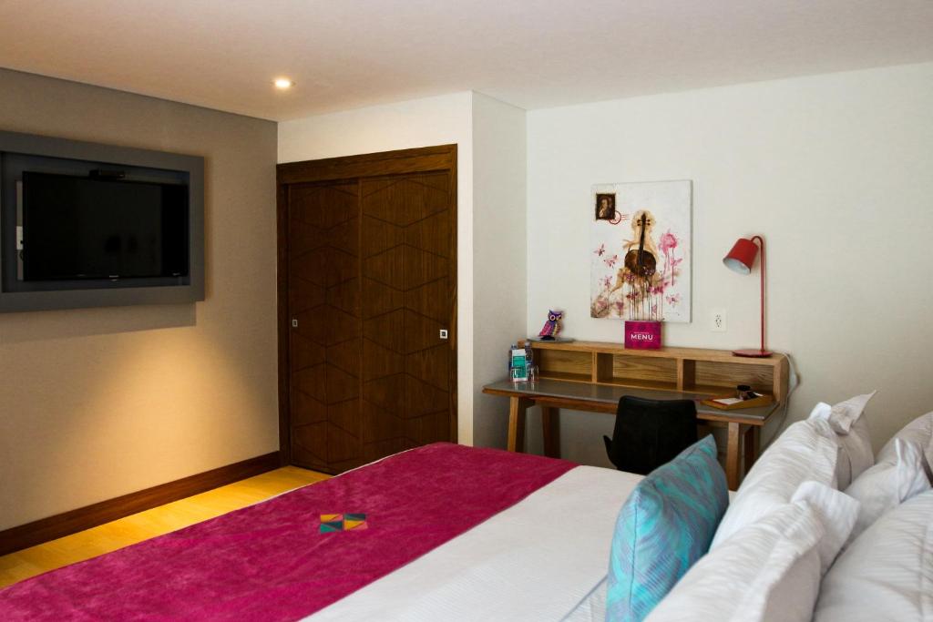 Postel nebo postele na pokoji v ubytování FCH Hotel Providencia