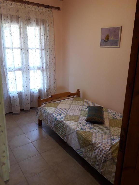 Postel nebo postele na pokoji v ubytování Olympian Garden Home