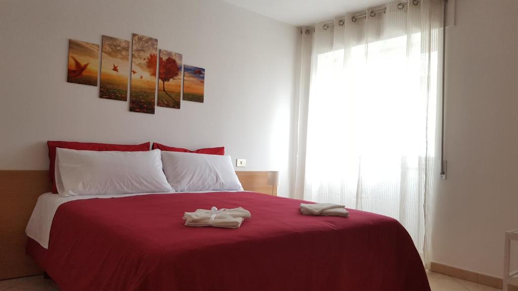 Posteľ alebo postele v izbe v ubytovaní Terrazza Zèfiro Casa vacanze