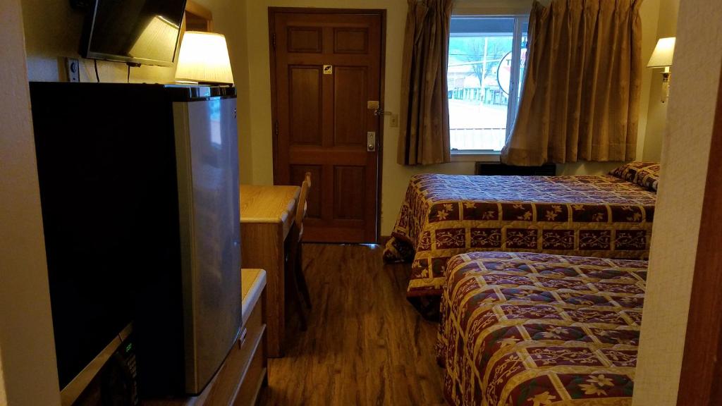 Postel nebo postele na pokoji v ubytování Royal Motor Inn
