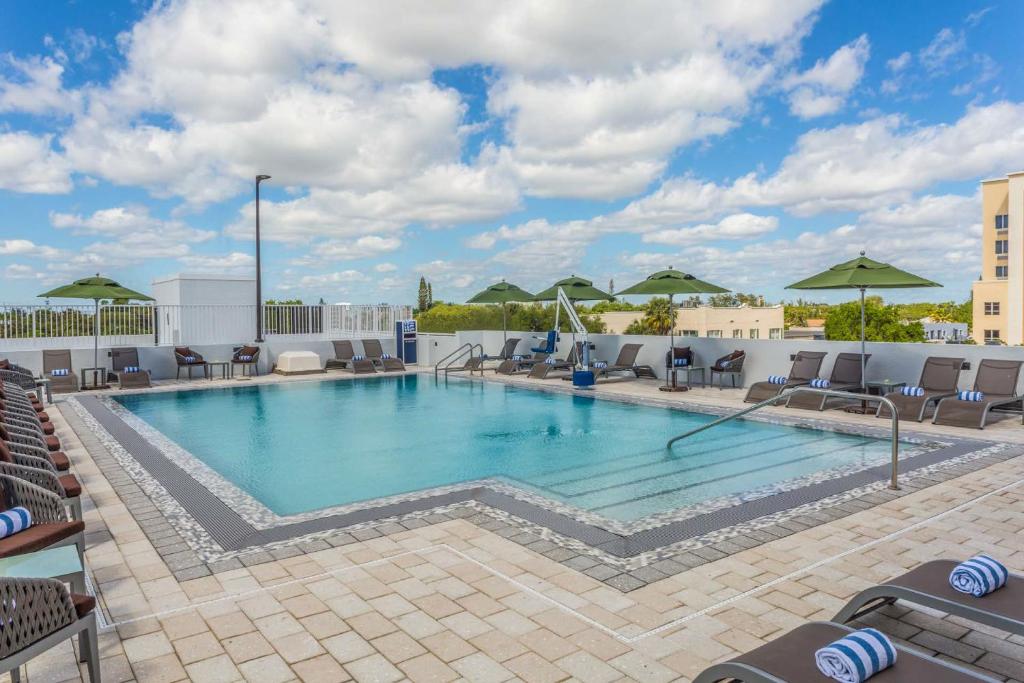 a swimming pool on the roof of a hotel at Wyndham Garden Ft Lauderdale Airport & Cruise Port in Dania Beach