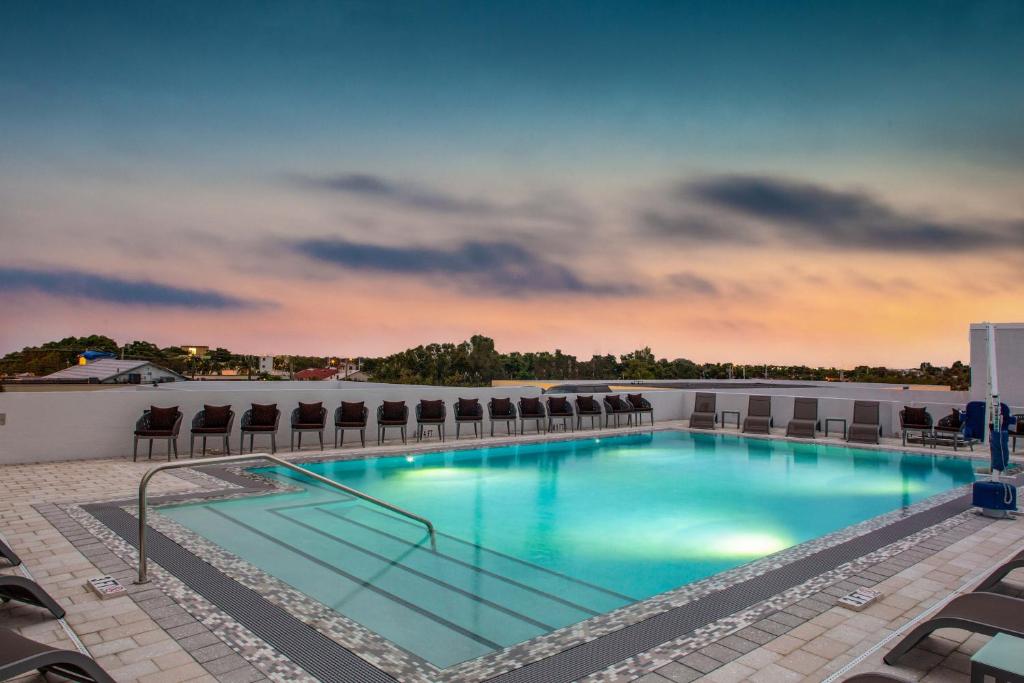 a swimming pool on the roof of a hotel at Wyndham Garden Ft Lauderdale Airport & Cruise Port in Dania Beach