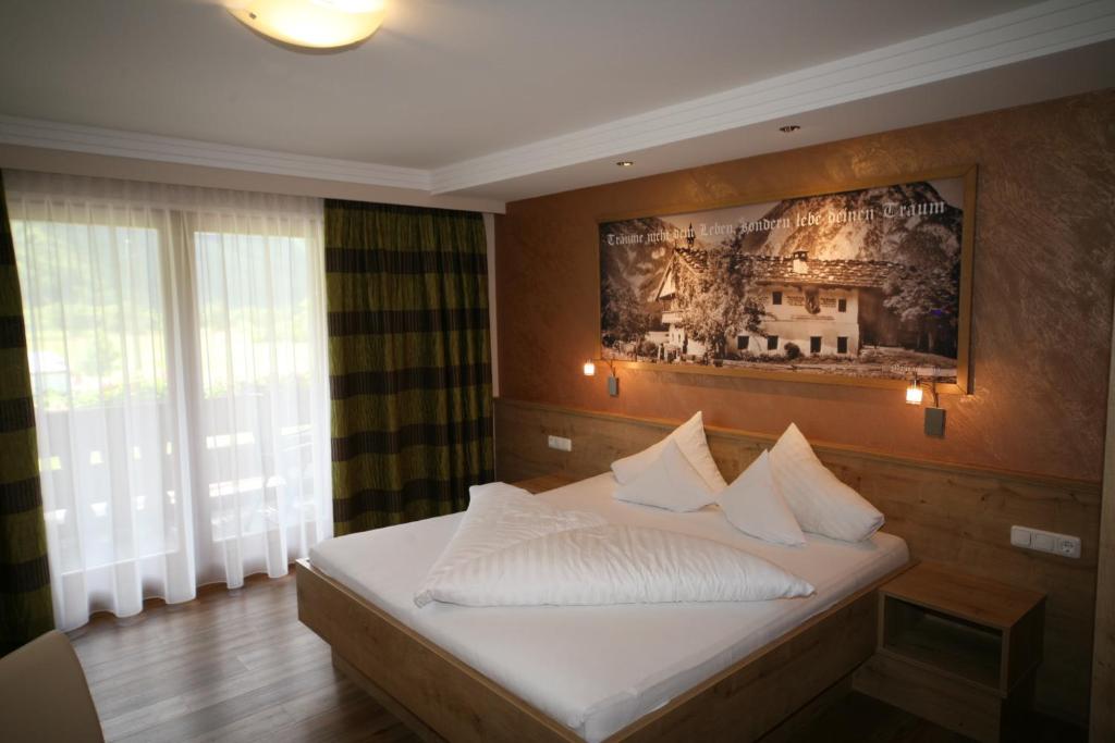 Postel nebo postele na pokoji v ubytování Frühstückshotel Margret