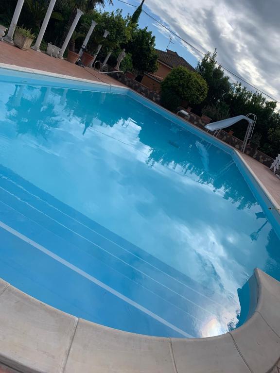 The swimming pool at or close to L'oasi di Ambra