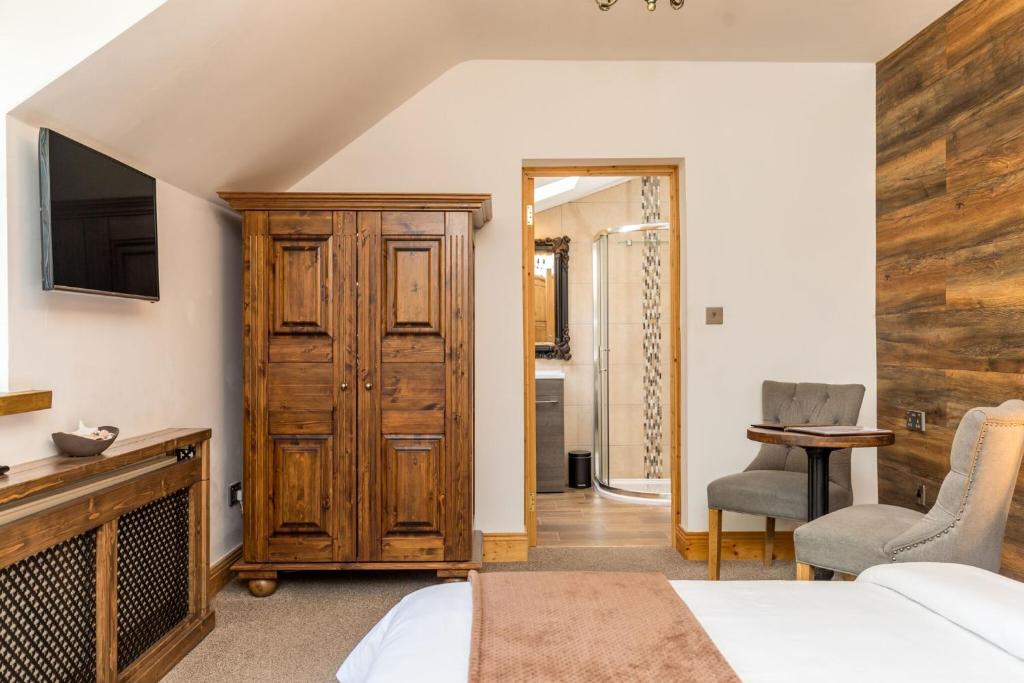 Postel nebo postele na pokoji v ubytování Rose Cottage B&B