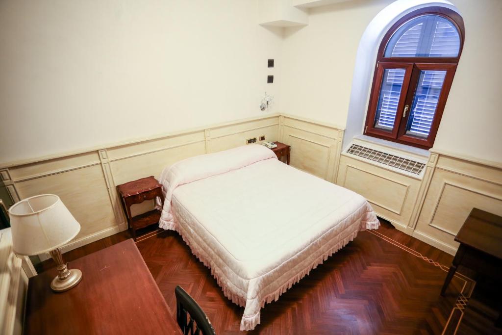 Postel nebo postele na pokoji v ubytování Olimpus