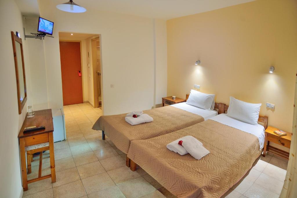 Postel nebo postele na pokoji v ubytování Falassarna Hotel