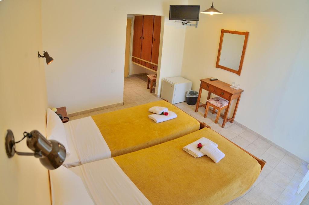 Postel nebo postele na pokoji v ubytování Falassarna Hotel