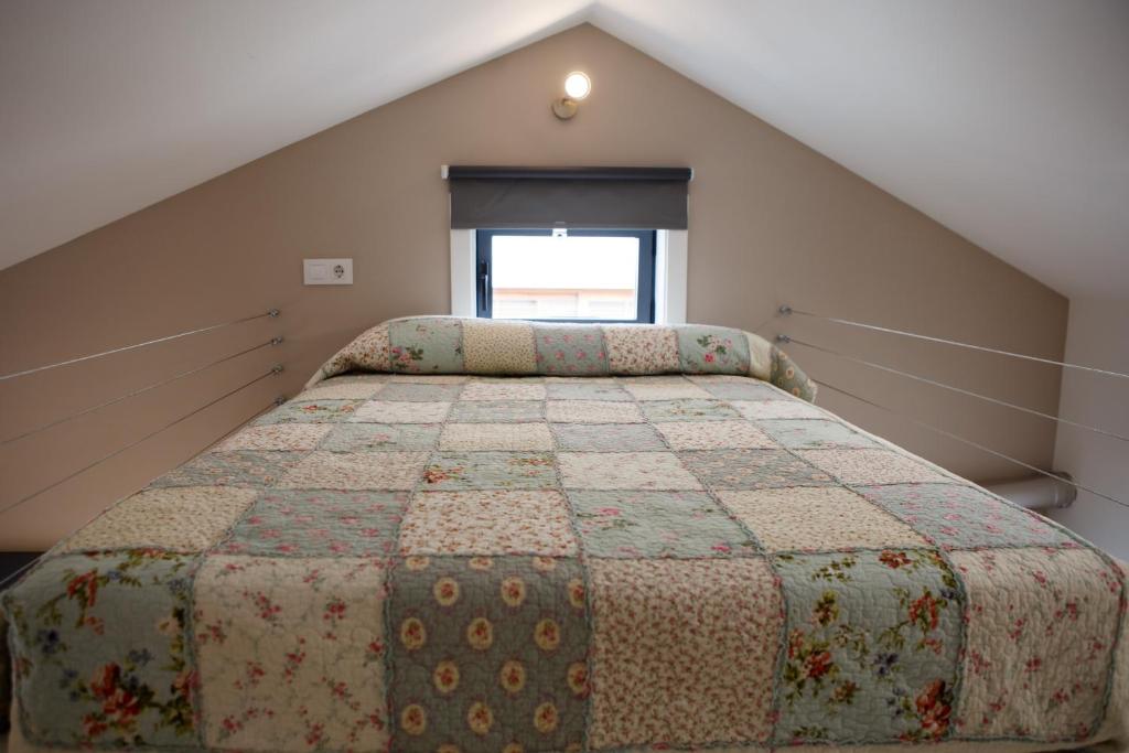 A bed or beds in a room at ESTUDIO REAL 8