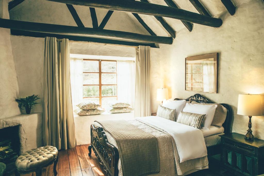 Postel nebo postele na pokoji v ubytování Hotel Hacienda Baza
