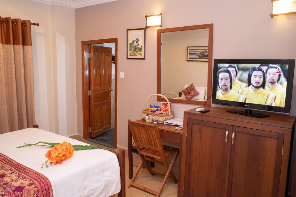 TV a/nebo společenská místnost v ubytování Villa Grange