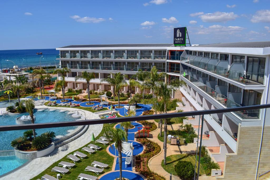 an aerial view of a hotel with a pool and resort at Faros Hotel Ayia Napa in Ayia Napa