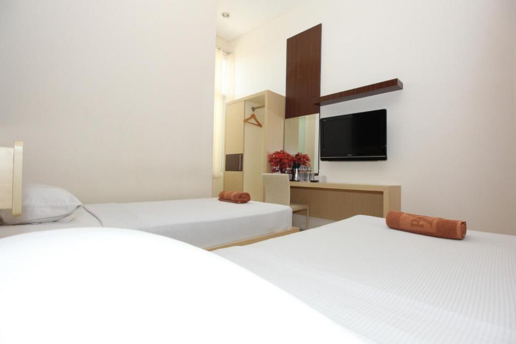 Postel nebo postele na pokoji v ubytování Ranez Inn
