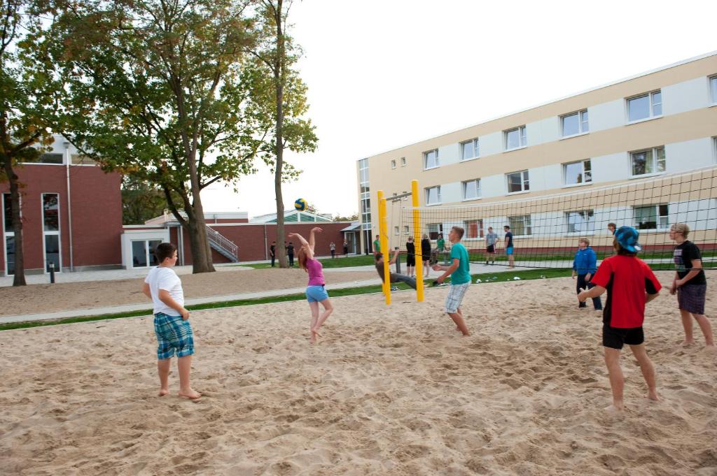 a group of people playing in the sand at Jugendherberge Wolfsburg in Wolfsburg