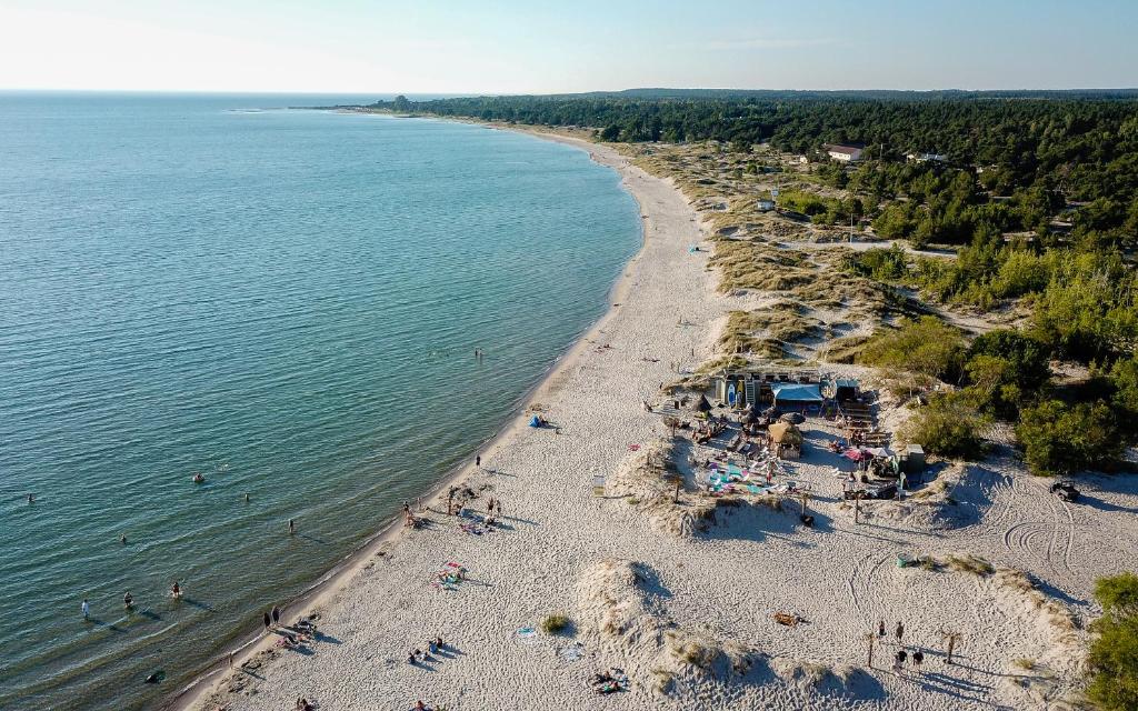 an overhead view of a beach with people in the water at Tofta Resort in Tofta