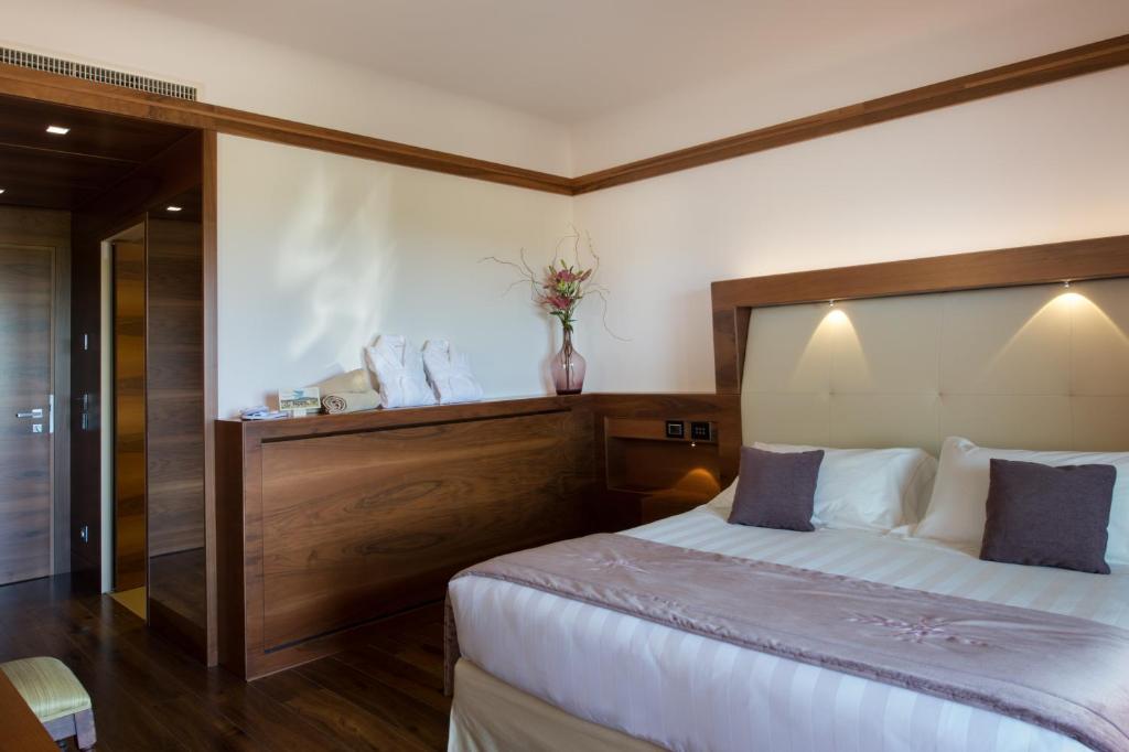Postel nebo postele na pokoji v ubytování Valle di Assisi Hotel & Spa