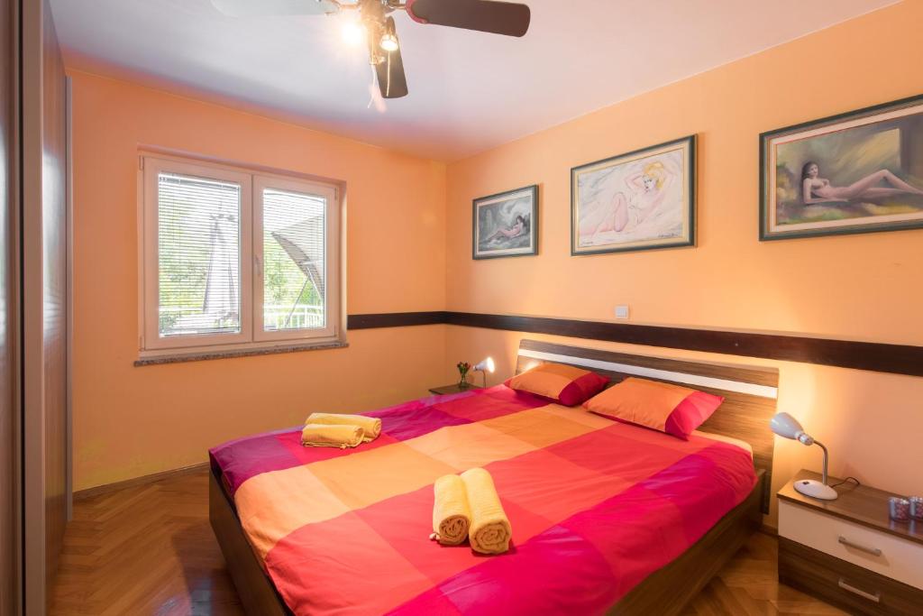 Postel nebo postele na pokoji v ubytování Apartment Josip Malin