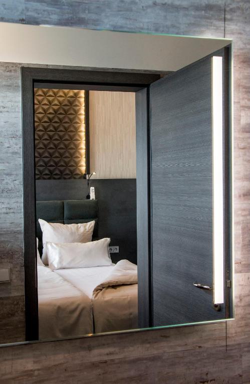 Postel nebo postele na pokoji v ubytování premium by GS Hotel