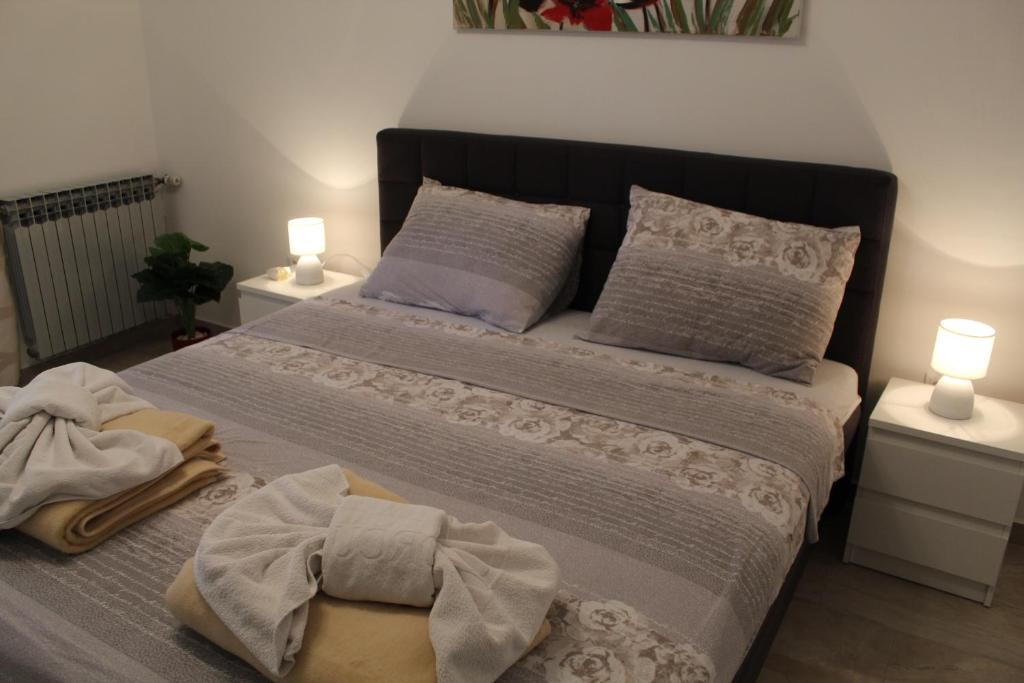 Postel nebo postele na pokoji v ubytování Korcula Apartments Iliskovic
