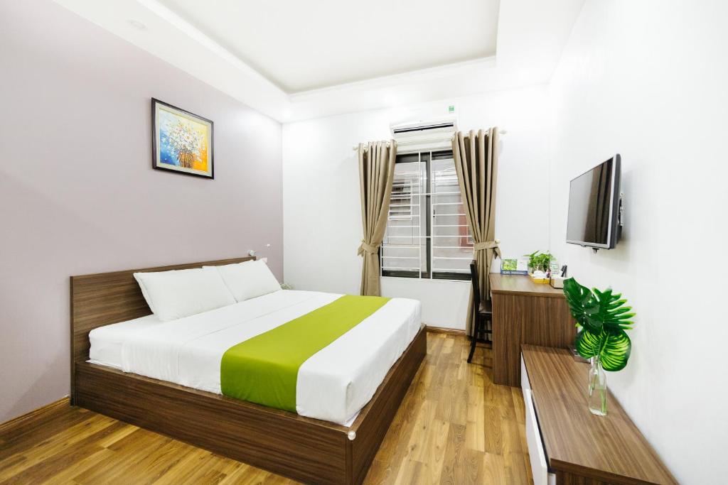 Postel nebo postele na pokoji v ubytování Hana 1 Apartment & Hotel Bac Ninh