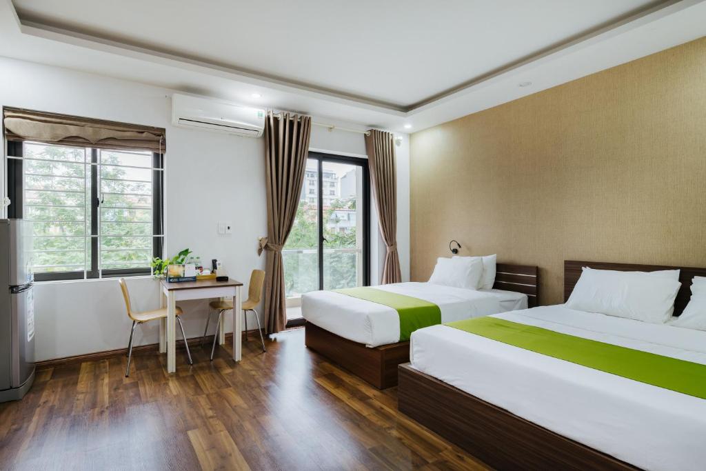 Postel nebo postele na pokoji v ubytování Hana 1 Apartment & Hotel Bac Ninh