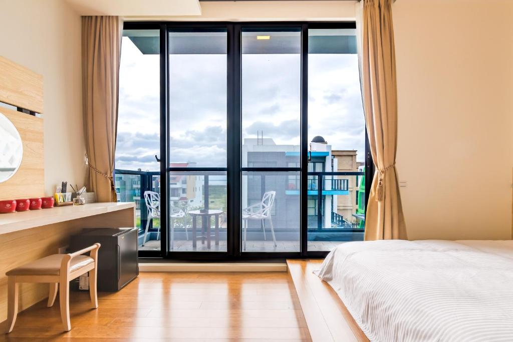 Postel nebo postele na pokoji v ubytování CHEN FENG HOMESTAY