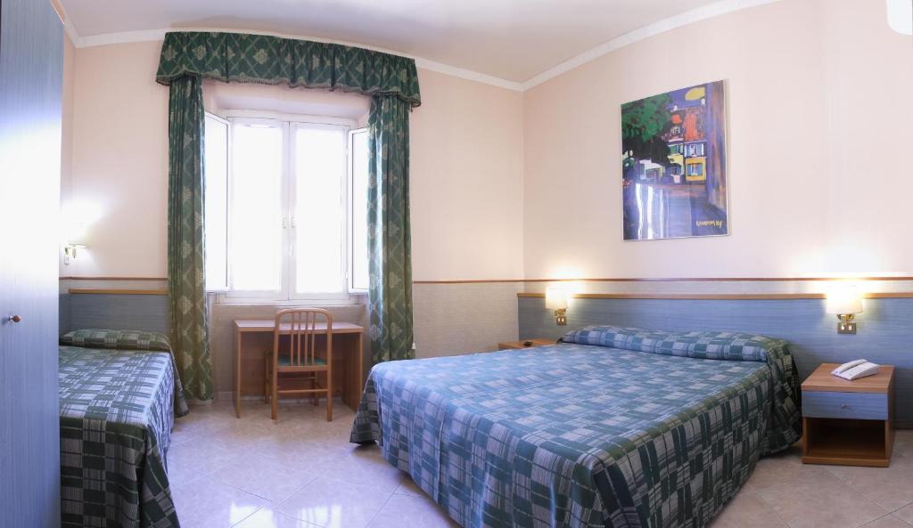 Postel nebo postele na pokoji v ubytování Hotel Lazzari