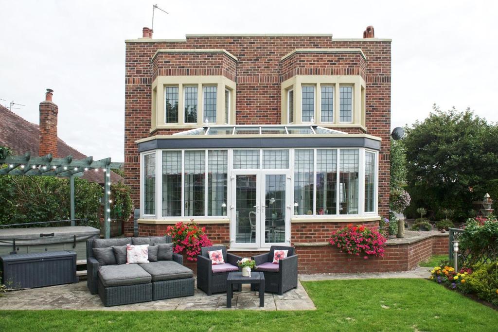 a house with a glassconservatory in the yard at Number One St Lukes in Blackpool