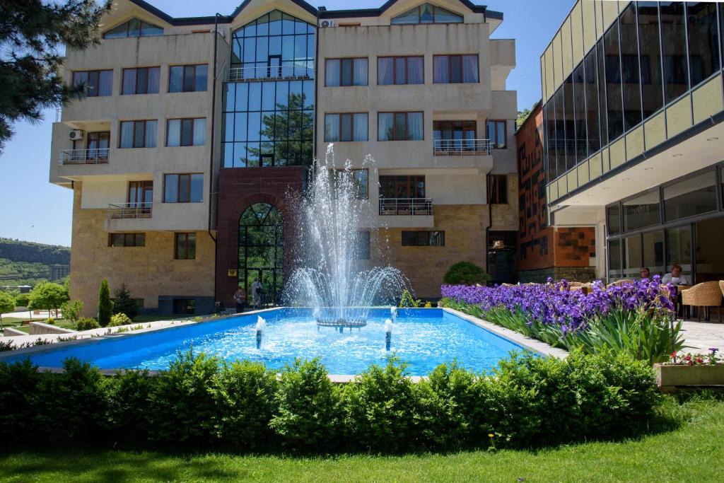 a fountain in front of a building at Arzni Health Resort in Arzni