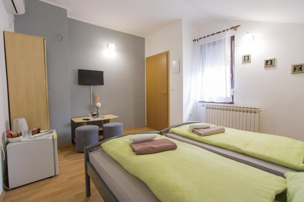 Postel nebo postele na pokoji v ubytování Guest House Stari