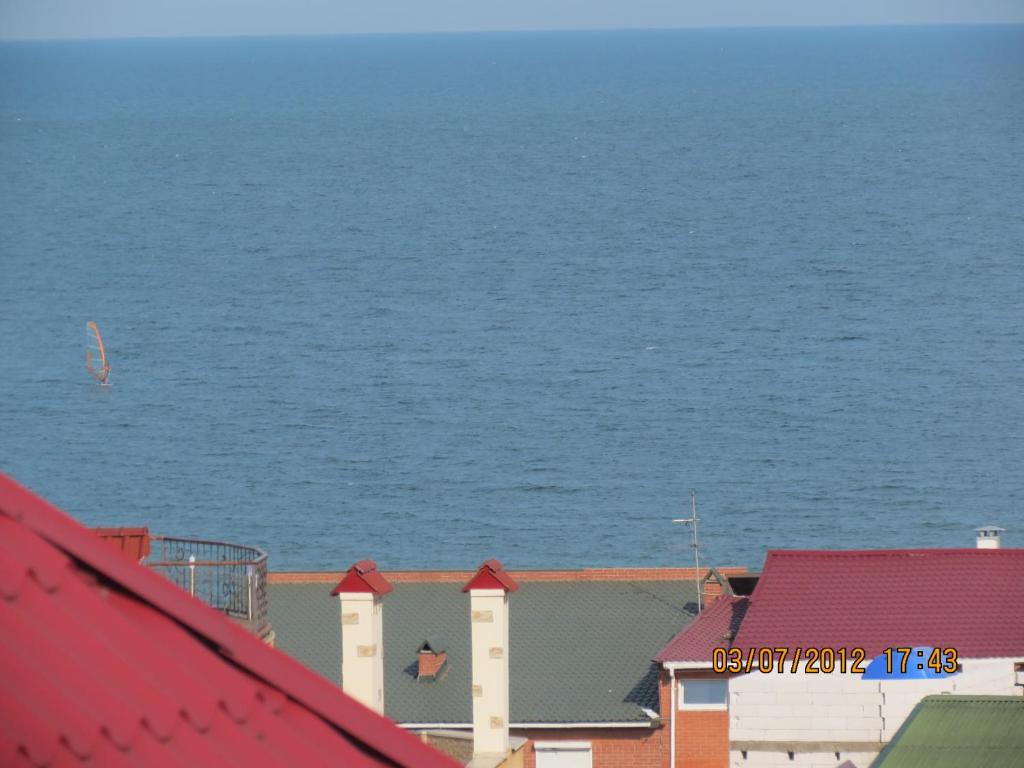 a view of the ocean from the roofs of buildings at Otdyh u Morya in Odesa