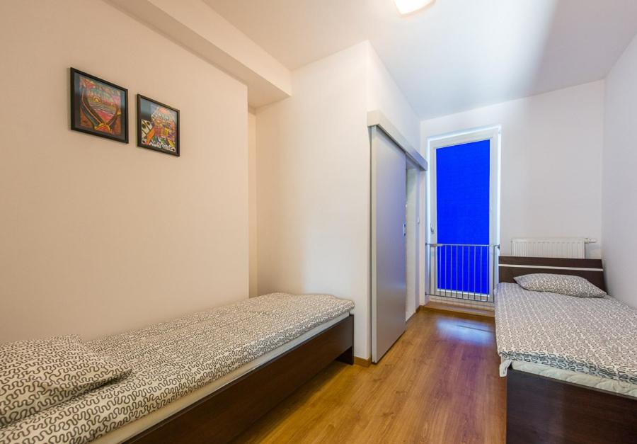 Postel nebo postele na pokoji v ubytování Lux Hostel - z prywatnymi łazienkami