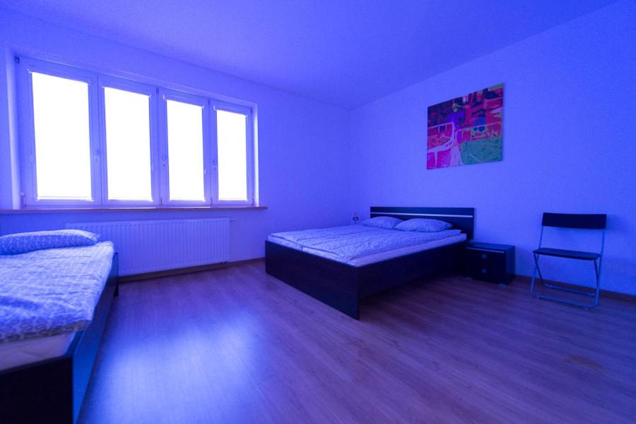 Postel nebo postele na pokoji v ubytování Lux Hostel - z prywatnymi łazienkami