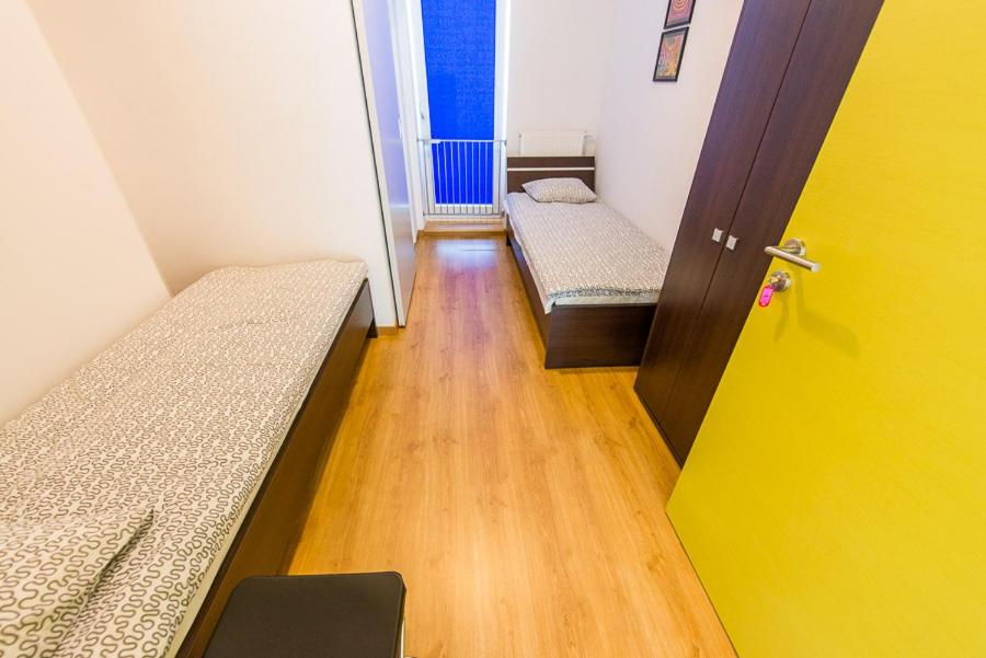 Postel nebo postele na pokoji v ubytování Lux Hostel - z prywatnymi łazienkami