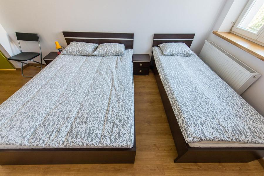 Postel nebo postele na pokoji v ubytování Lux Hostel - z prywatnymi łazienkami