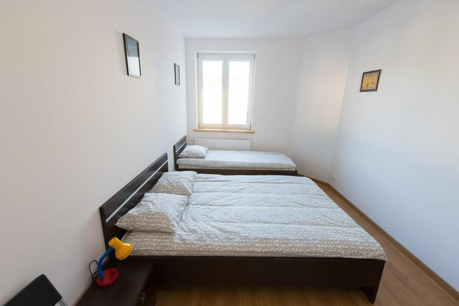 Postel nebo postele na pokoji v ubytování Lux Hostel - z prywatnymi łazienkami